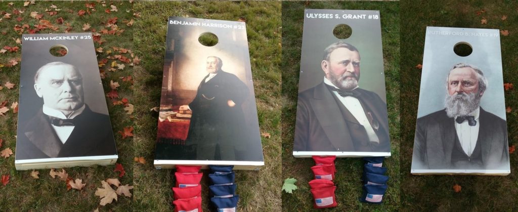 Four corn hole boards, 2 feet by 4 feet, each with an image of one of the four presidents who visited Roseland Cottage